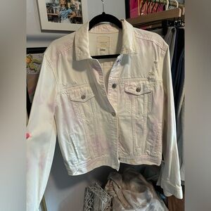 Distressed pastel toned white denim jacket